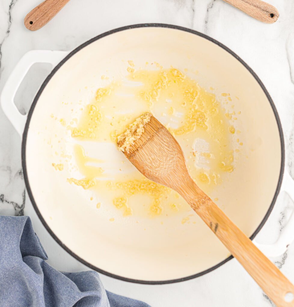 stirring minced garlic