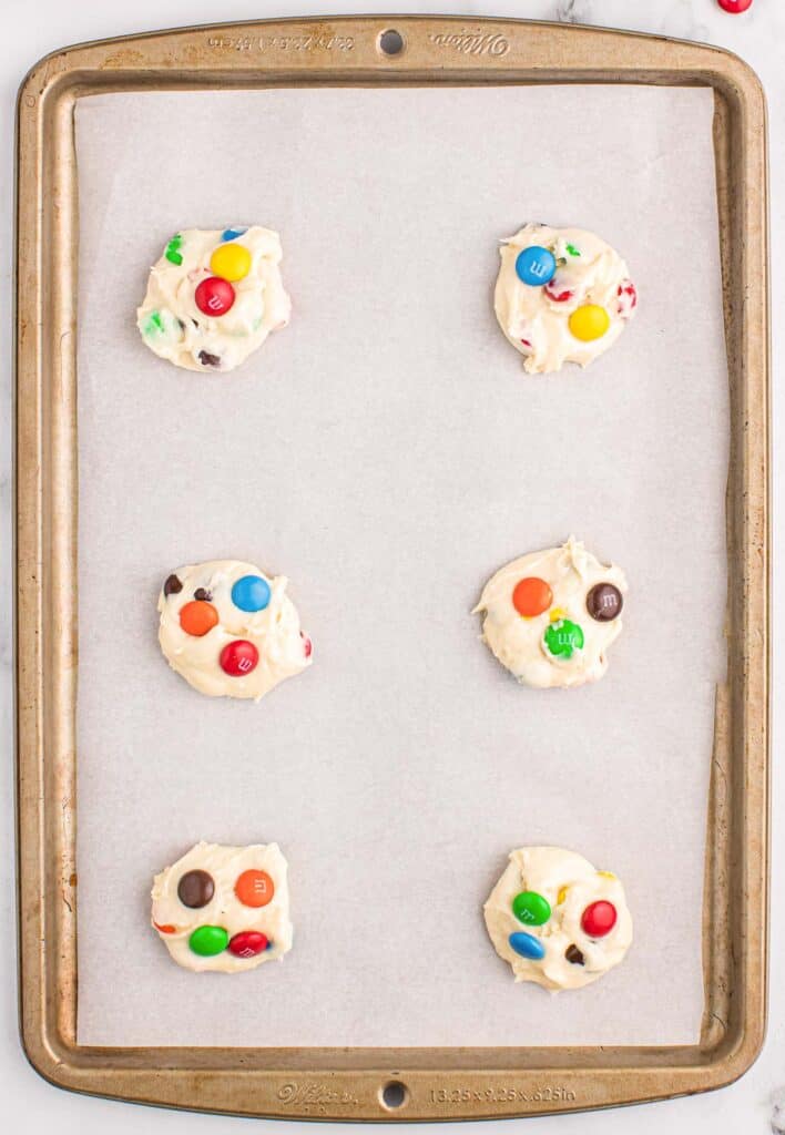 cake mix cookie batter on a lined baking sheet