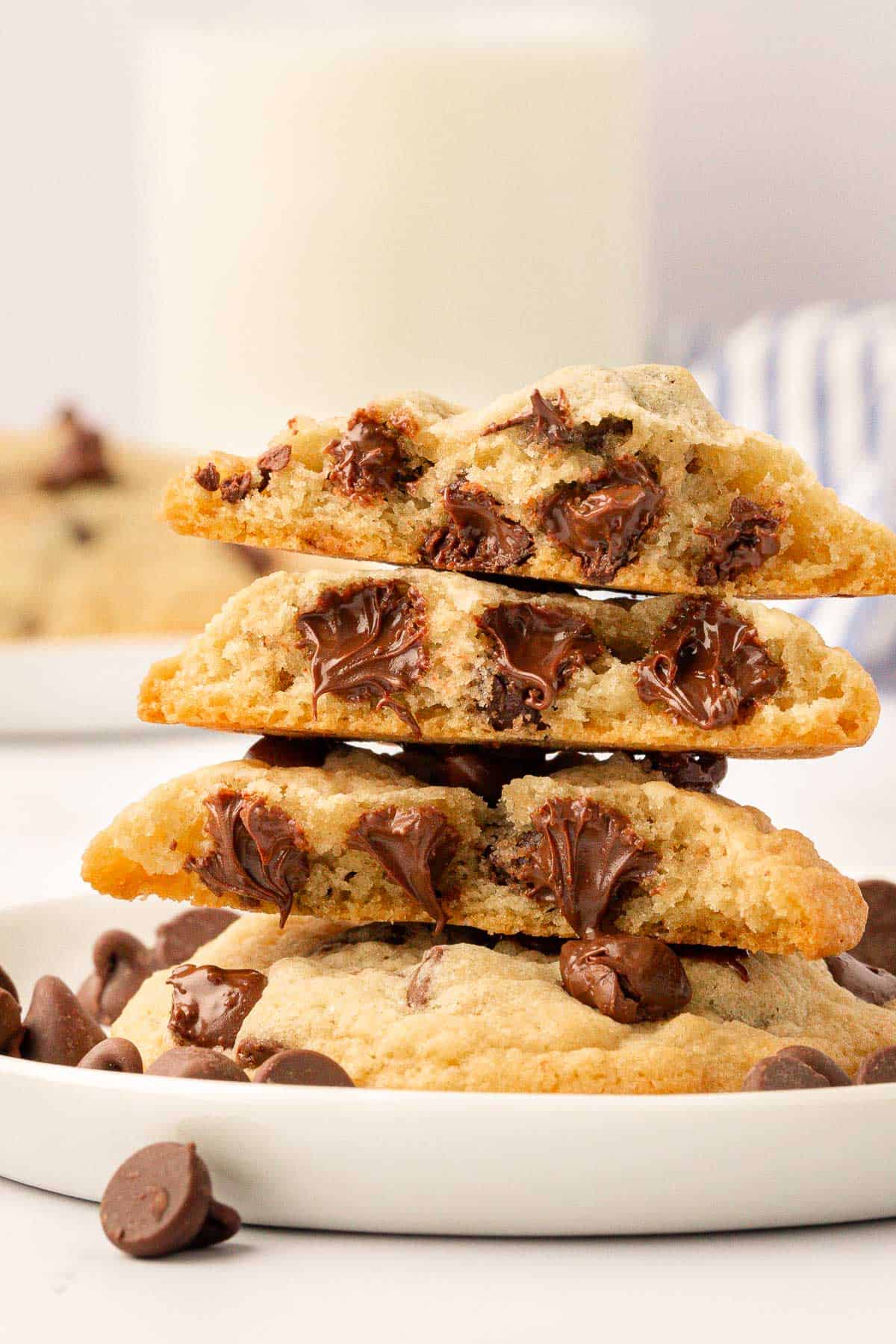 chocolate chip cookies broken open to show the melted chocolate chips