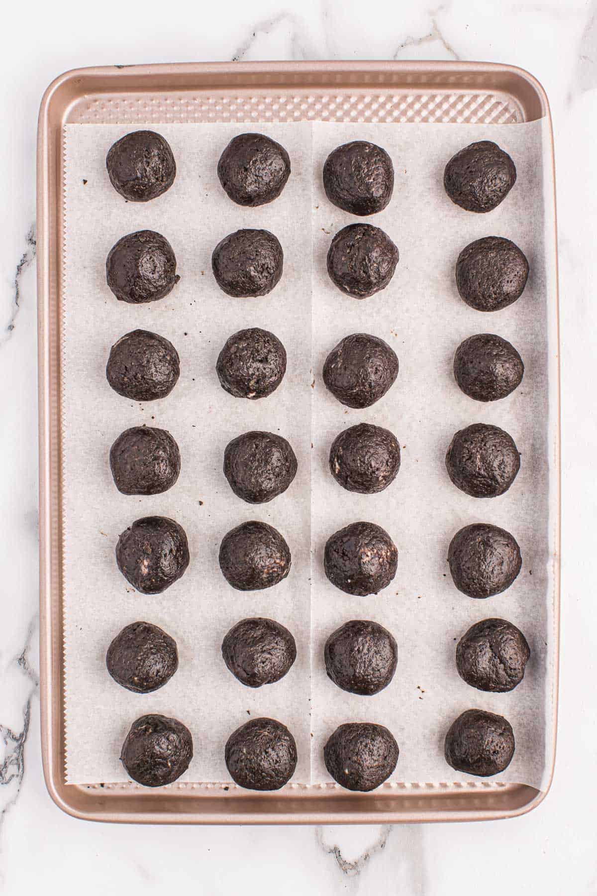 oreo balls on a baking sheet