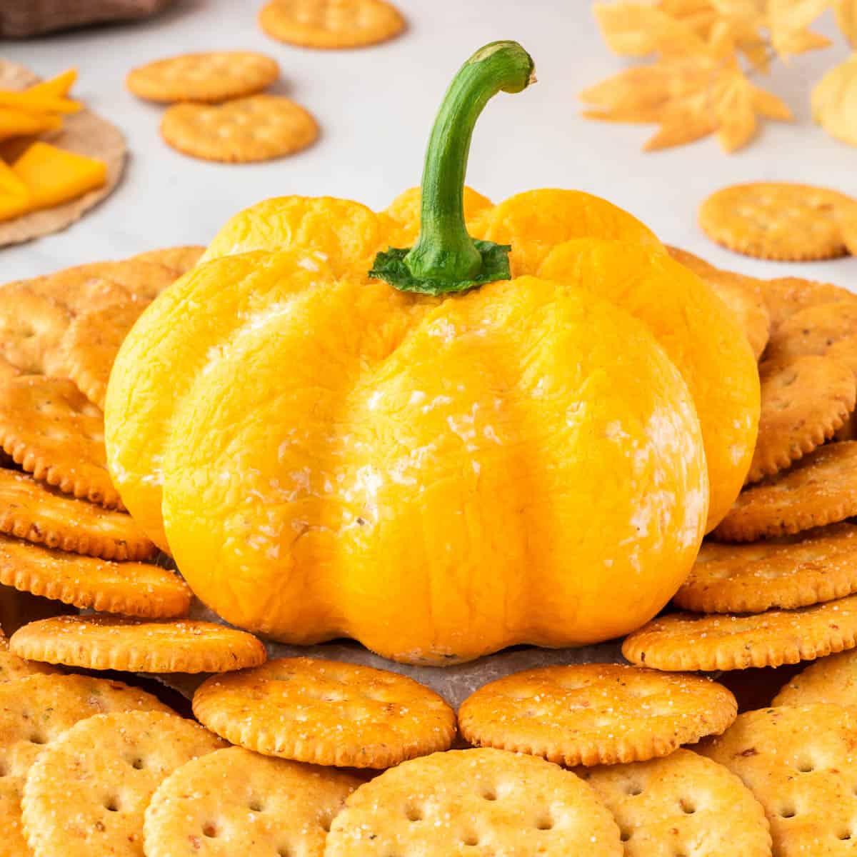 pumpkin shaped cheese ball with crackers