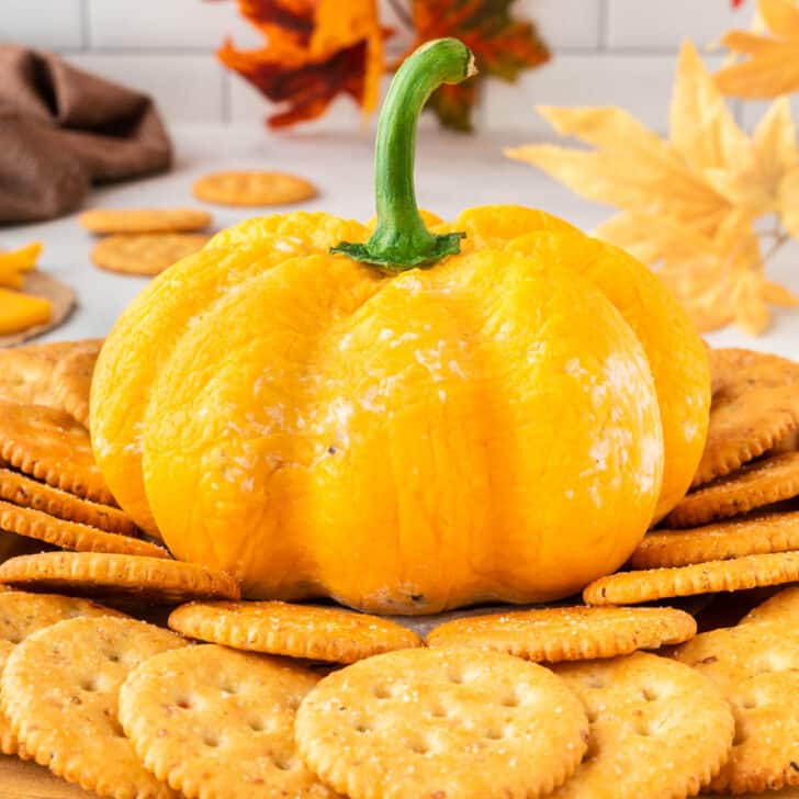 pumpkin shaped cheese ball with crackers