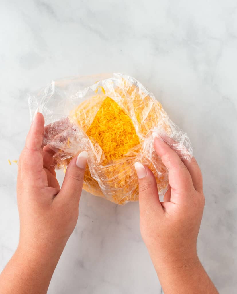 wrapping the cheese ball with cling wrap