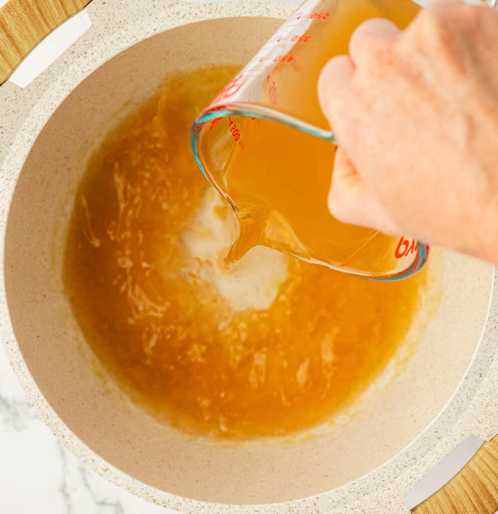 pouring vegetable broth