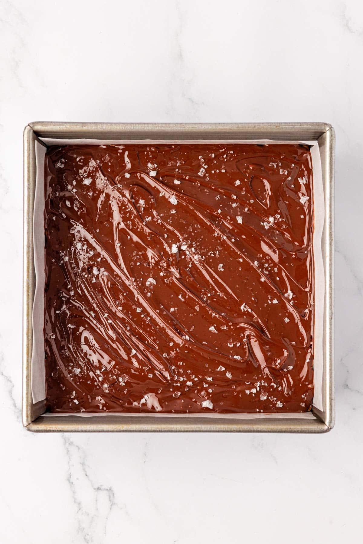 melted chocolate with sea salt flakes spread over the protein bars