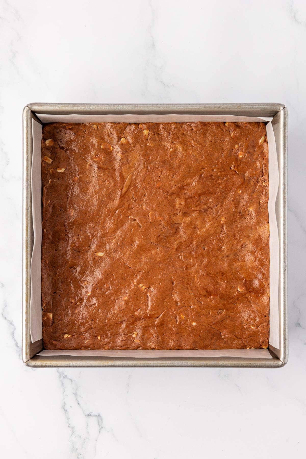 chocolate protein bars pressed into an 8 by 8 dish
