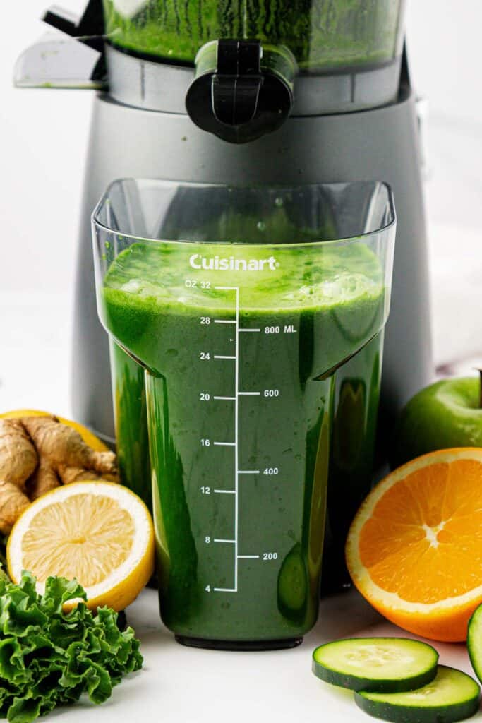 kale juice in the juicing canister