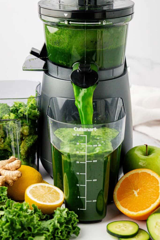 kale juice coming out of the juicer