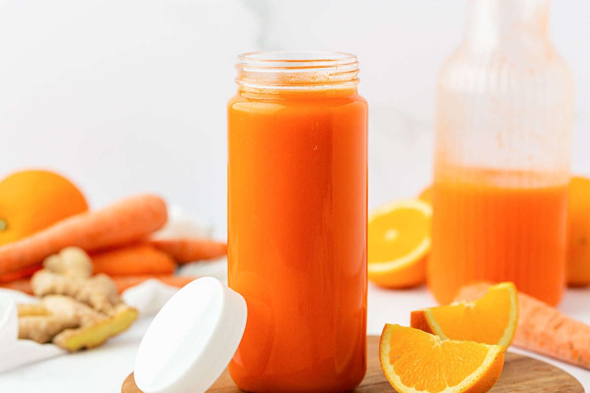 carrot juice in a glass with a lid