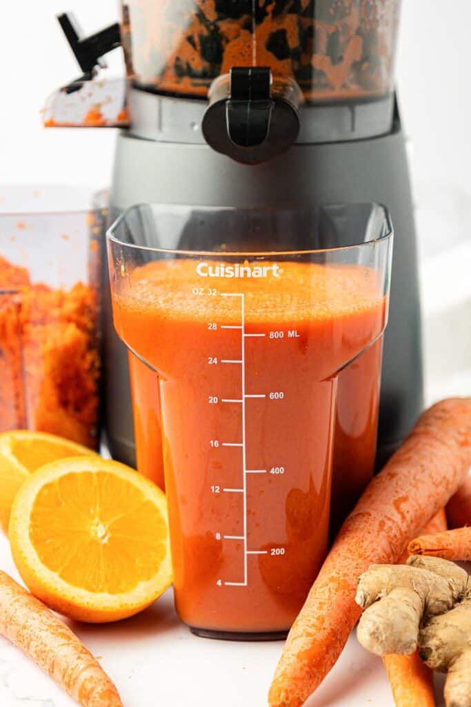 carrot juice in a juicing canister