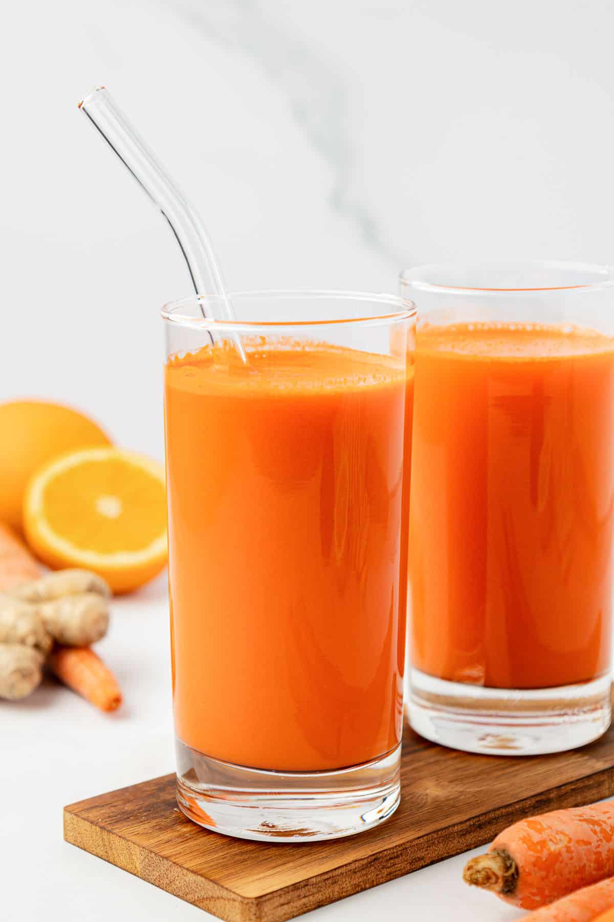 carrot juice in a glass with a straw