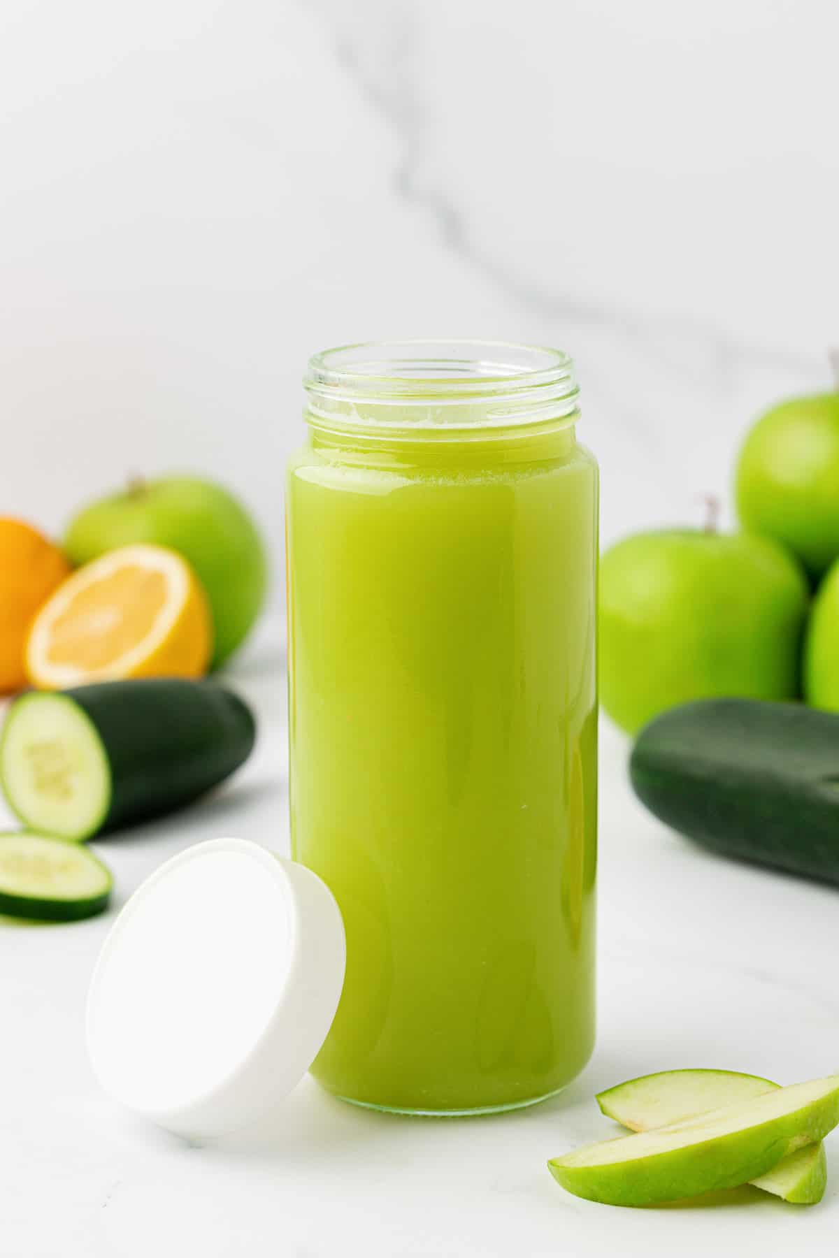 green apple juice in a storage jar with a lid