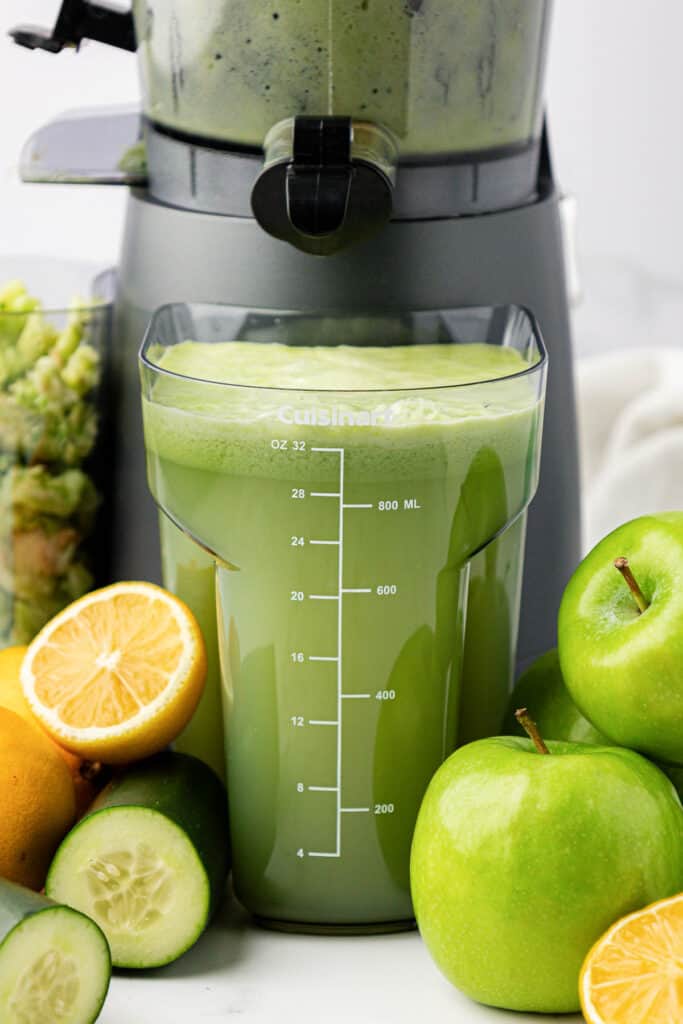 green apple juice in the juicing canister