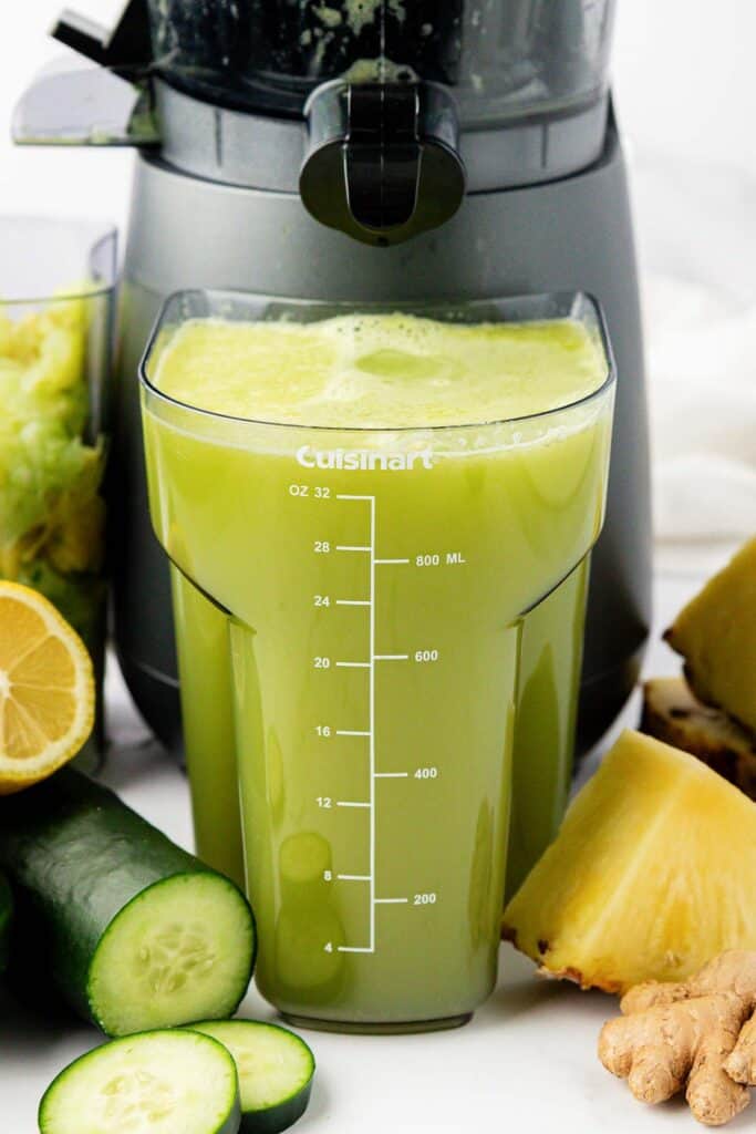 pineapple cucumber juice in a juicing canister