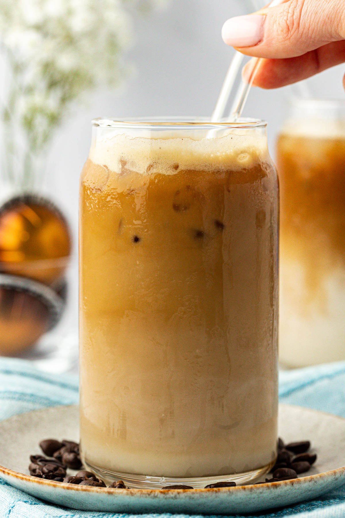 iced espresso in a glass with a straw