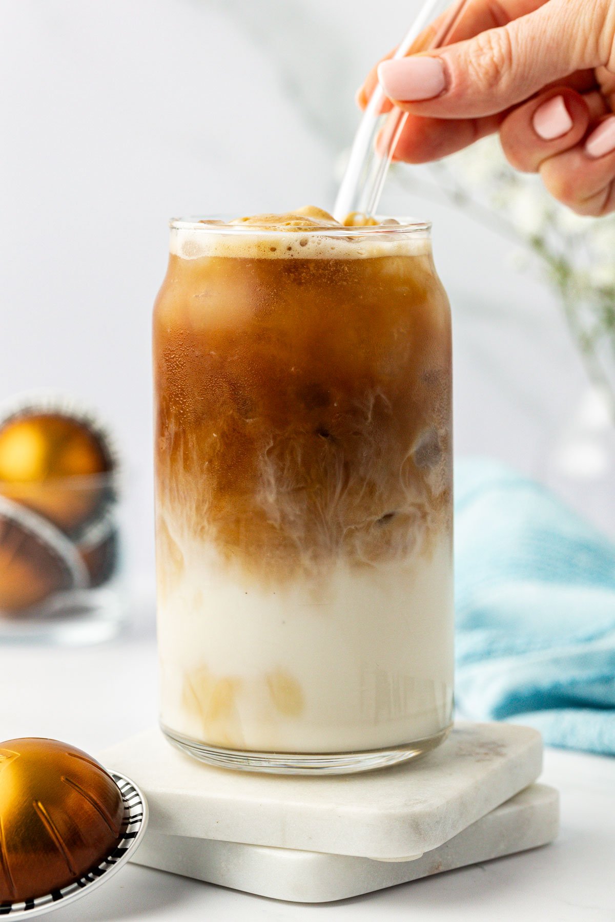 iced espresso in a glass with a straw