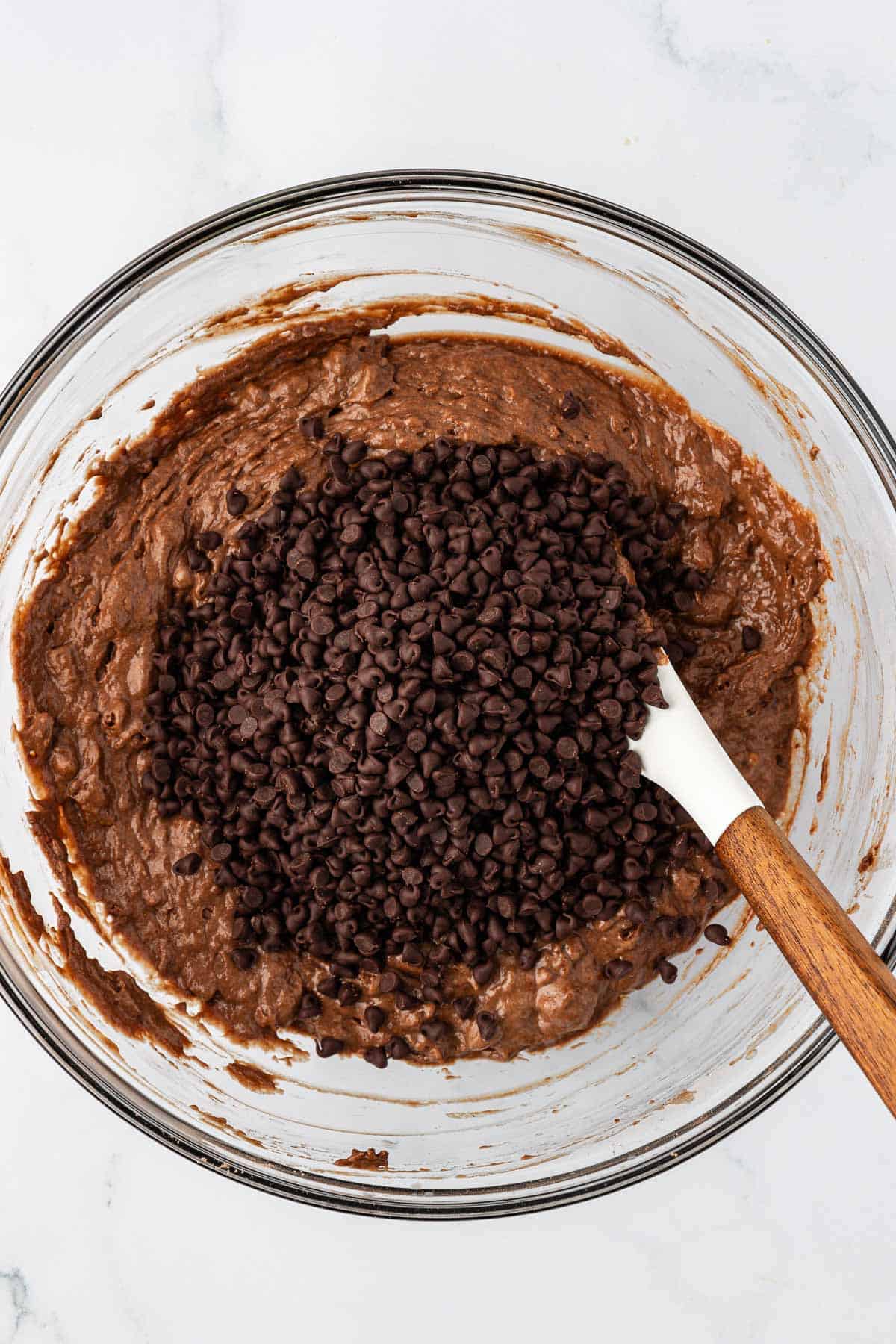 adding the chocolate chips to the batter