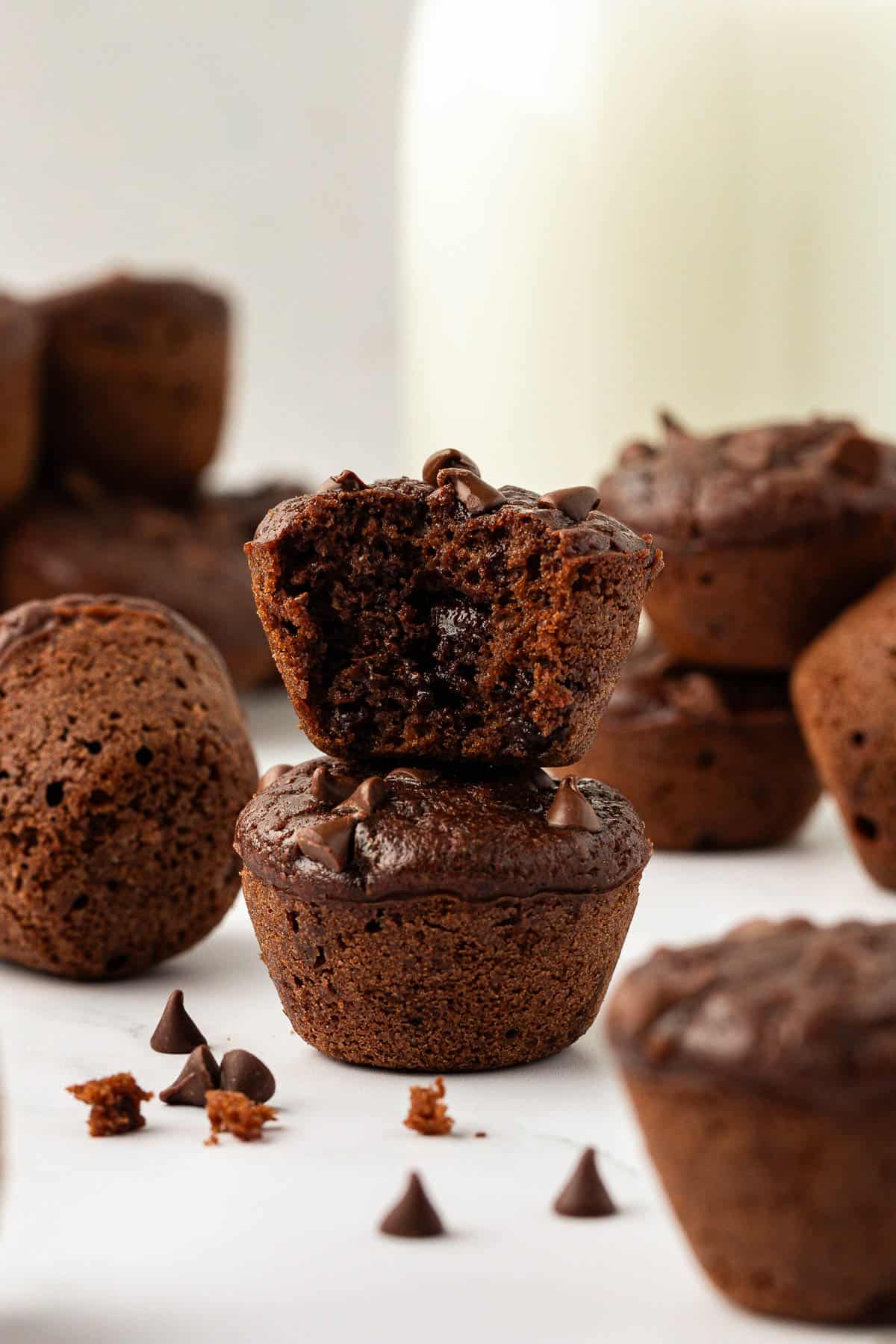 healthy chocolate mini muffins stacked on top of each other