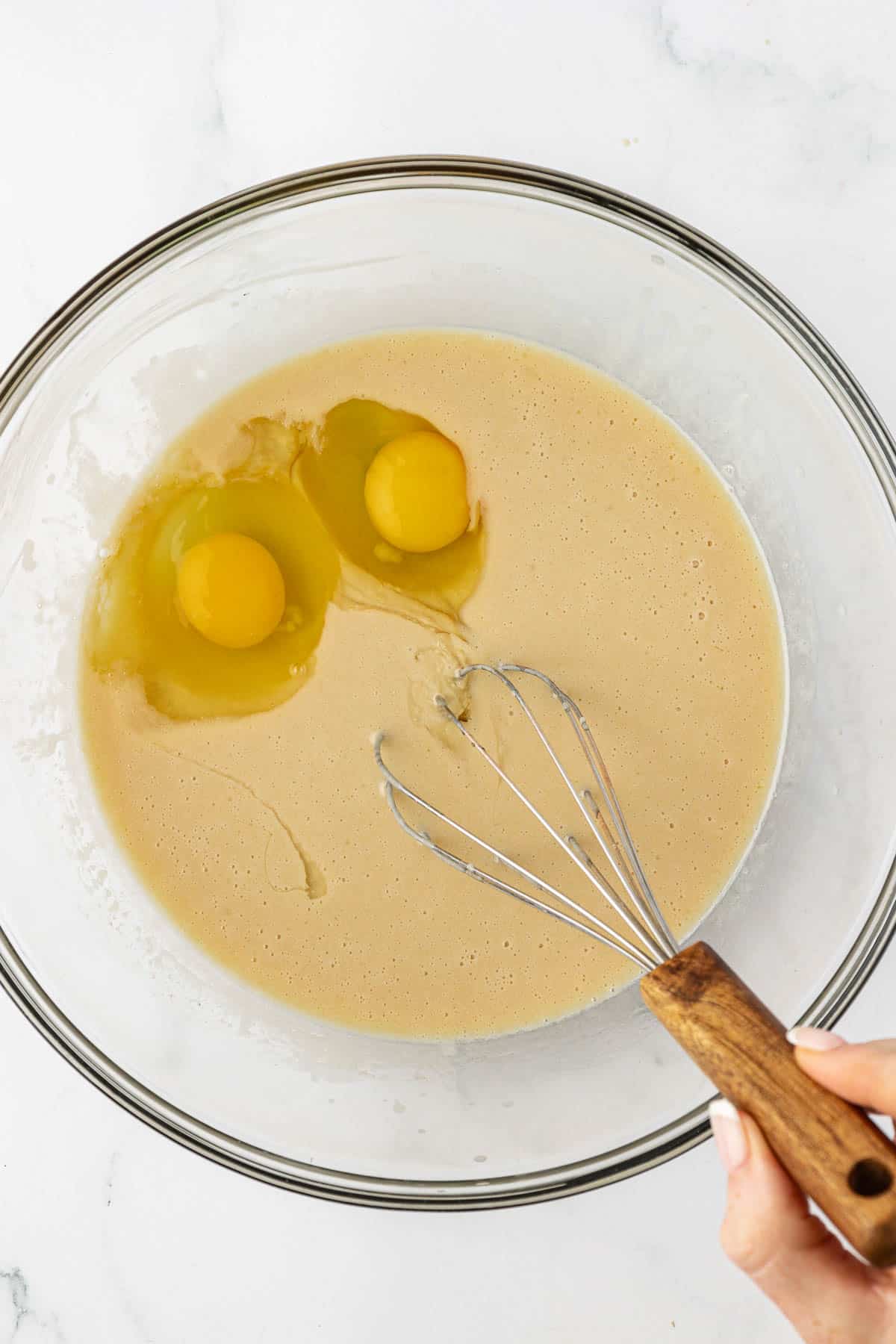 whisking the eggs into the wet ingredients