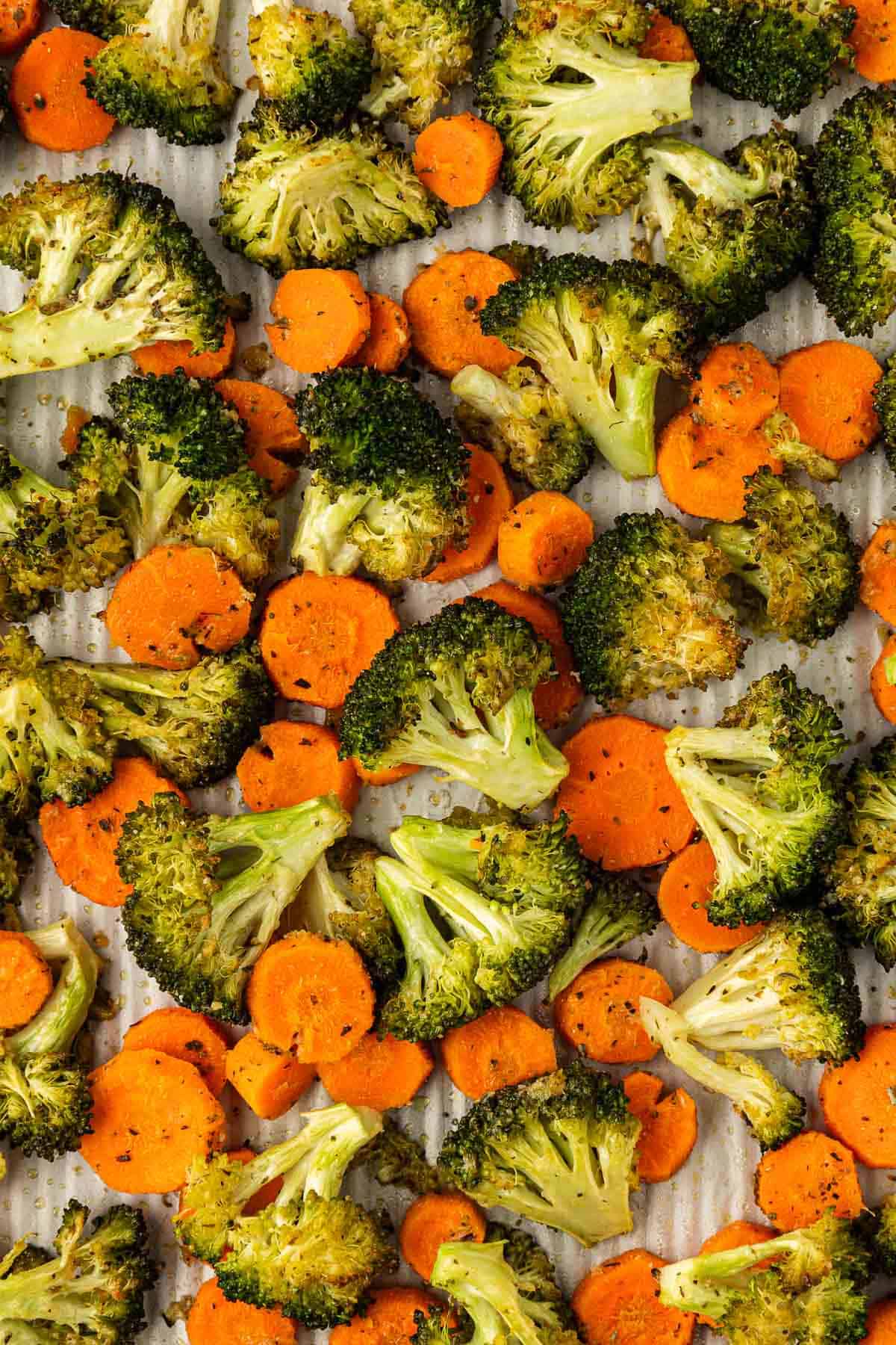 roasted broccoli and carrots on a baking sheet