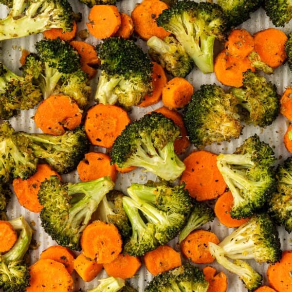 roasted broccoli and carrots on a baking sheet