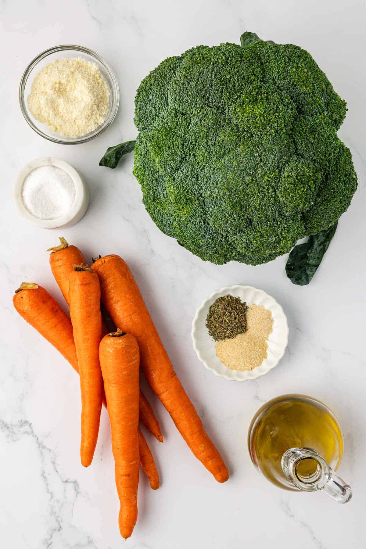 a head of broccoli, 5 carrots, parmesan cheese, olive oil, and spices