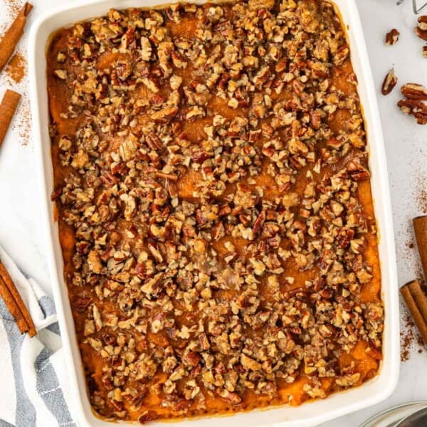 sweet potato casserole with pecans in a baking dish