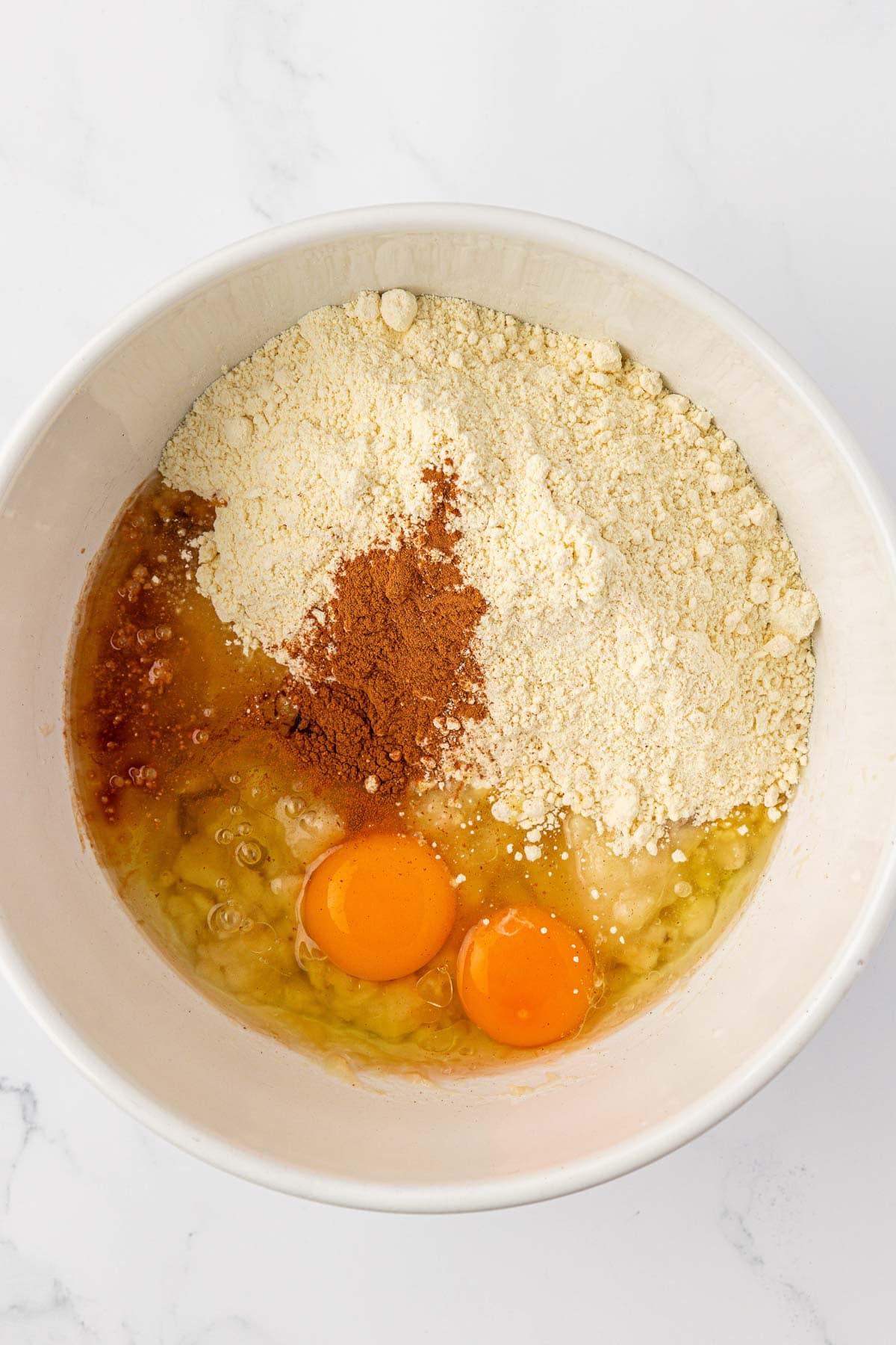 cake mix banana bread ingredients in a mixing bowl