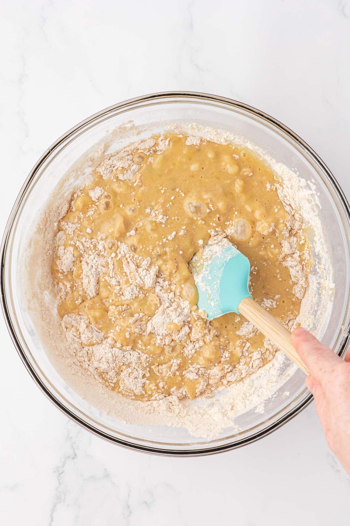 folding the dry ingredients into the wet ingredients