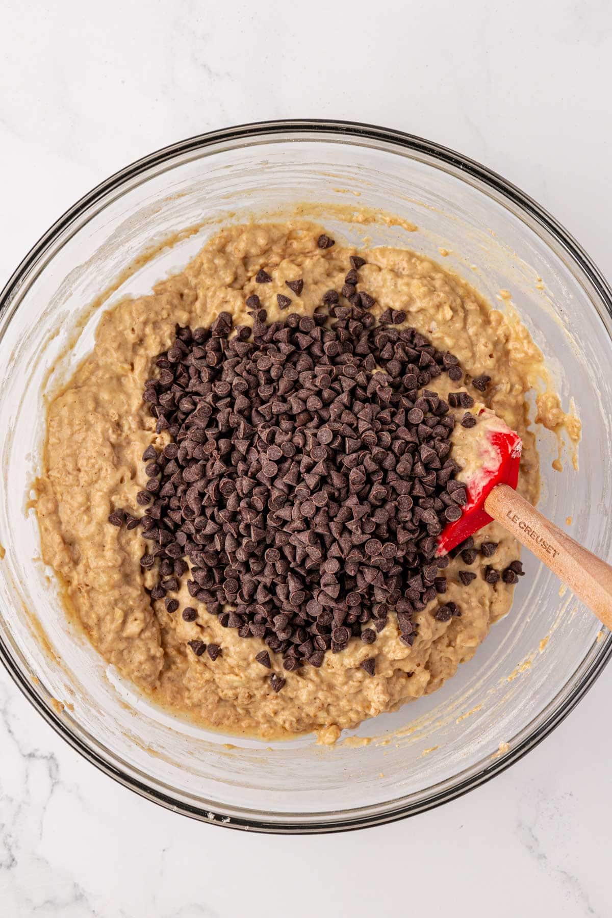 adding the mini chocolate chips to the batter