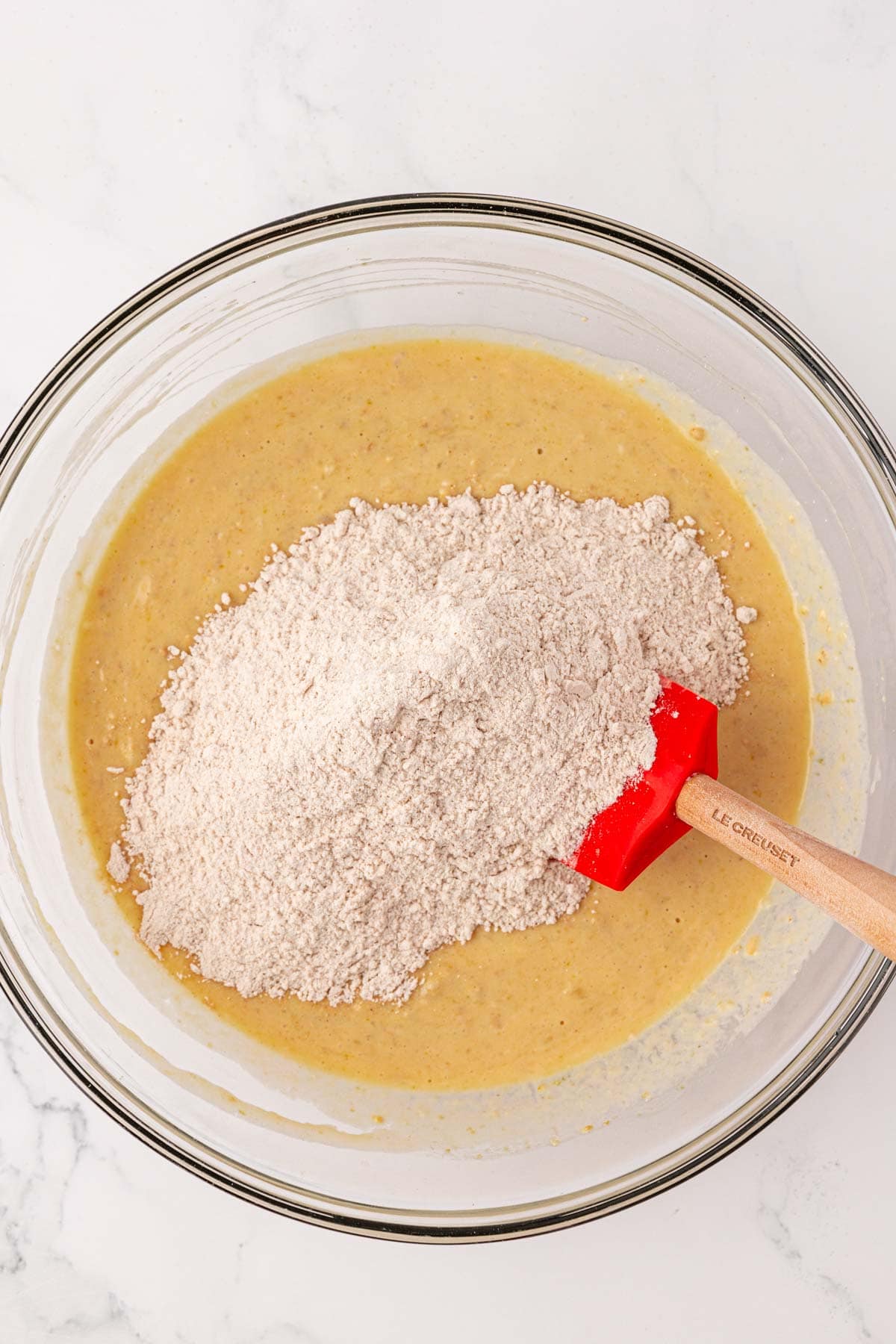 adding the dry ingredients to the wet ingredients