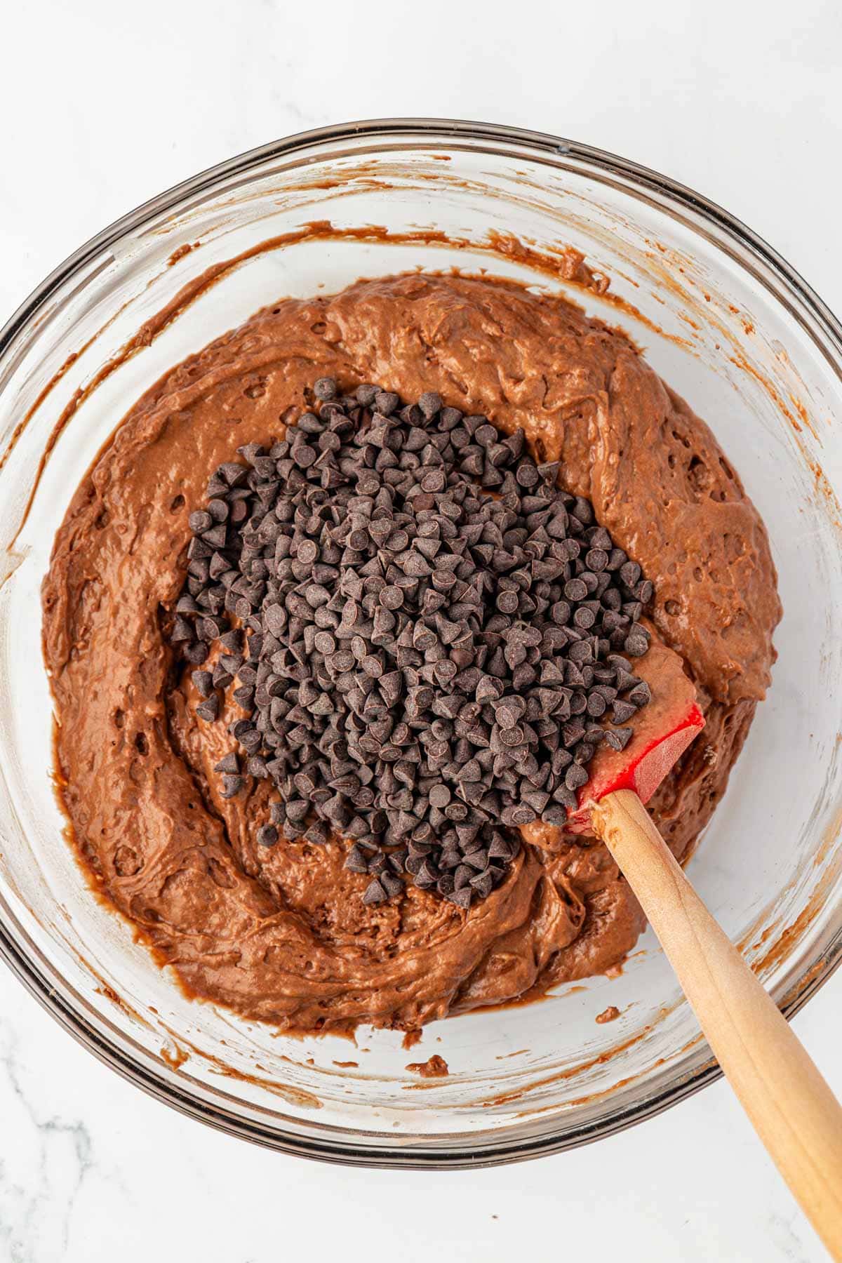 adding the mini chocolate chips to the batter