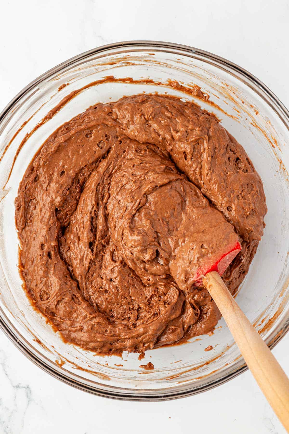mixing the dry ingredients into the wet ingredients