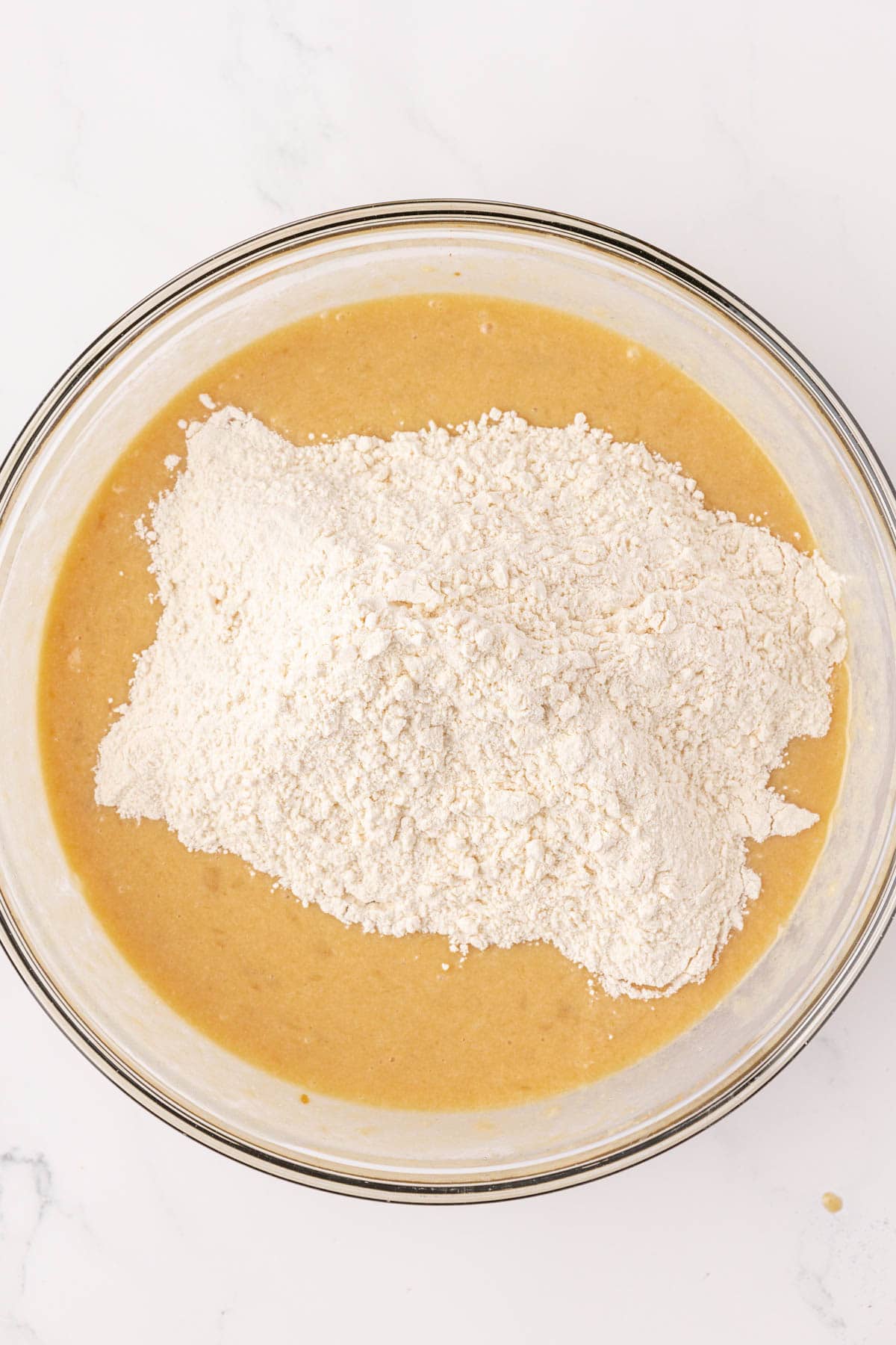 adding the dry ingredients to the wet ingredients