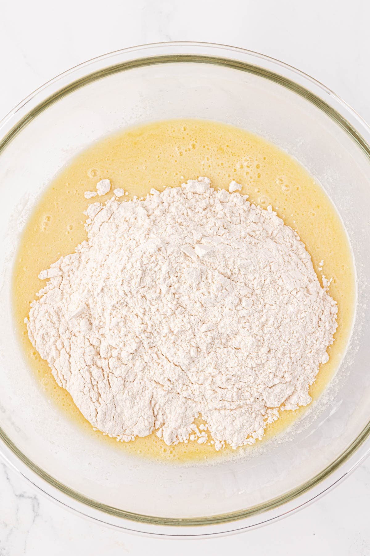 adding the dry ingredients to the wet ingredients