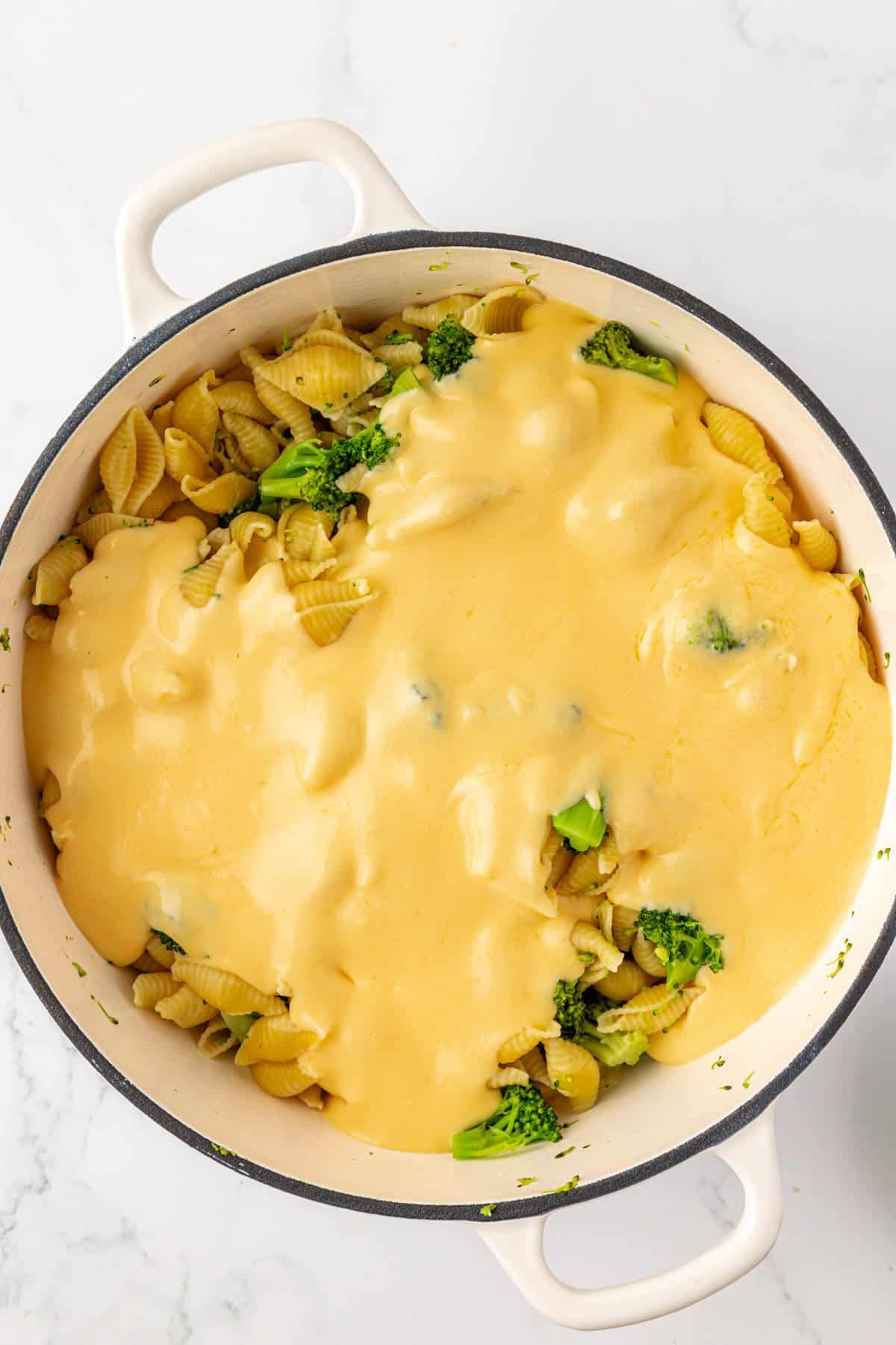 adding the cheese sauce