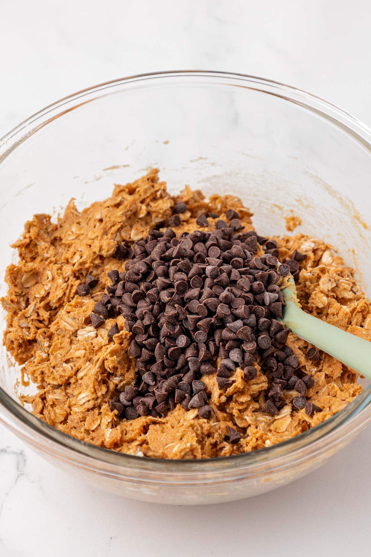 adding the mini chocolate chips to the batter