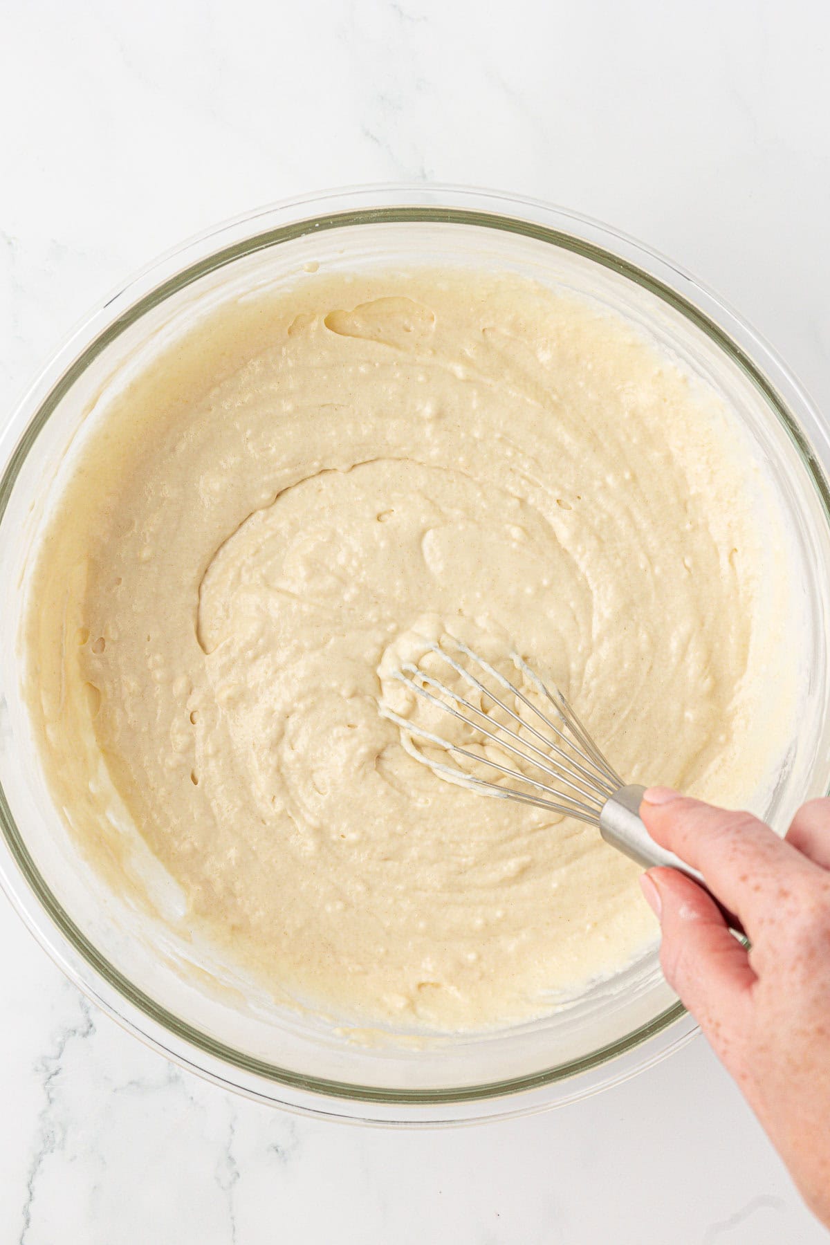 whisking the Greek yogurt waffle batter together