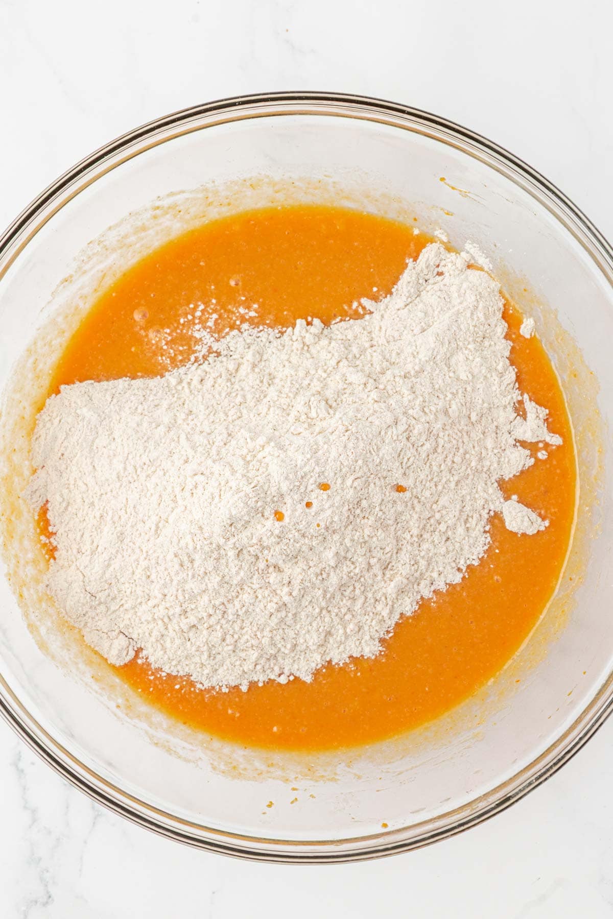 adding the dry ingredients to the wet ingredients