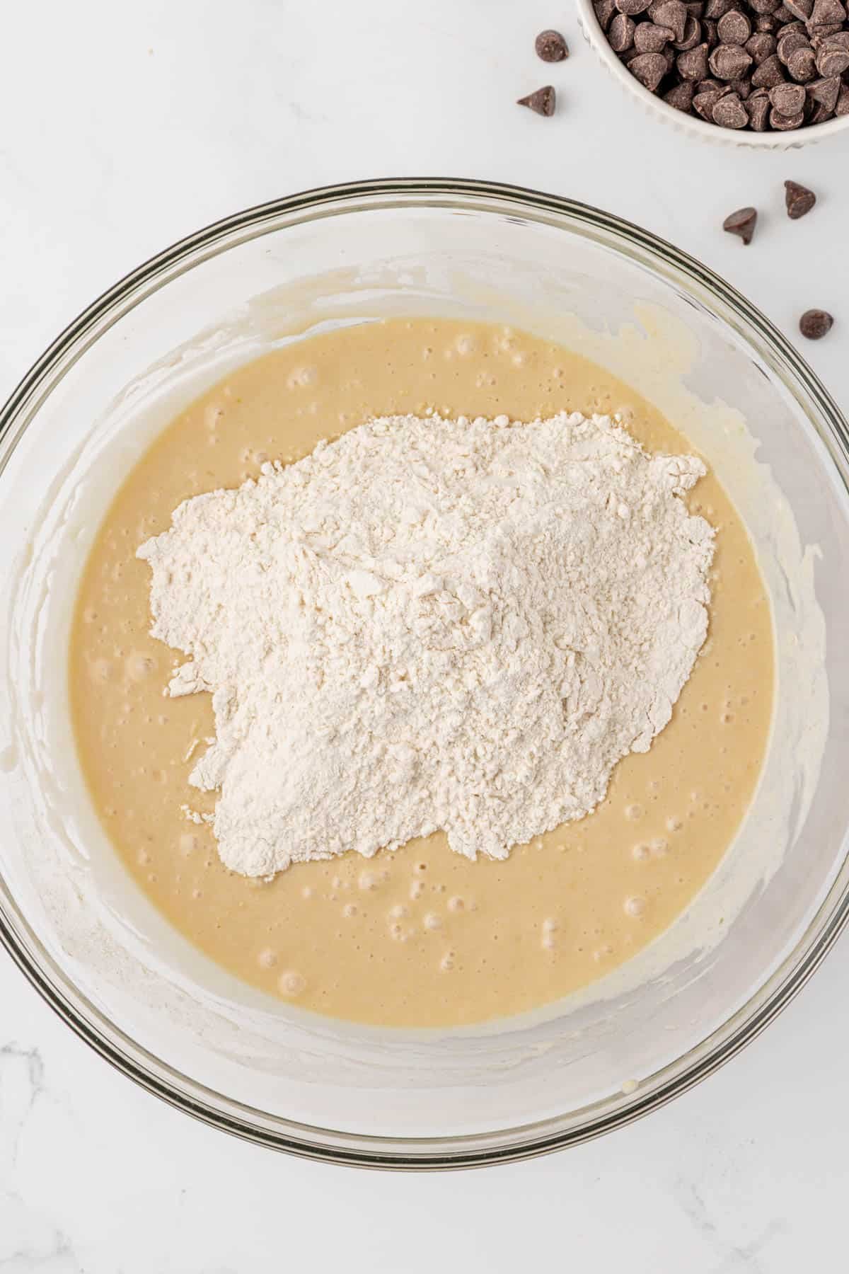 adding the dry ingredients to the wet ingredients