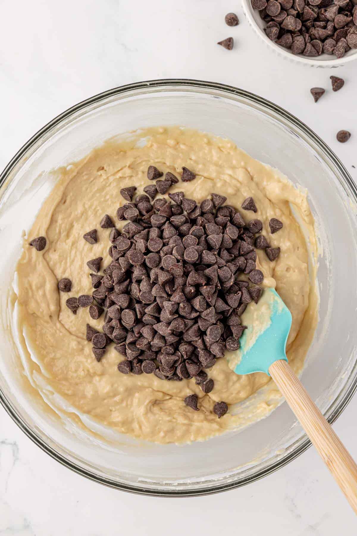 adding the chocolate chips to the batter
