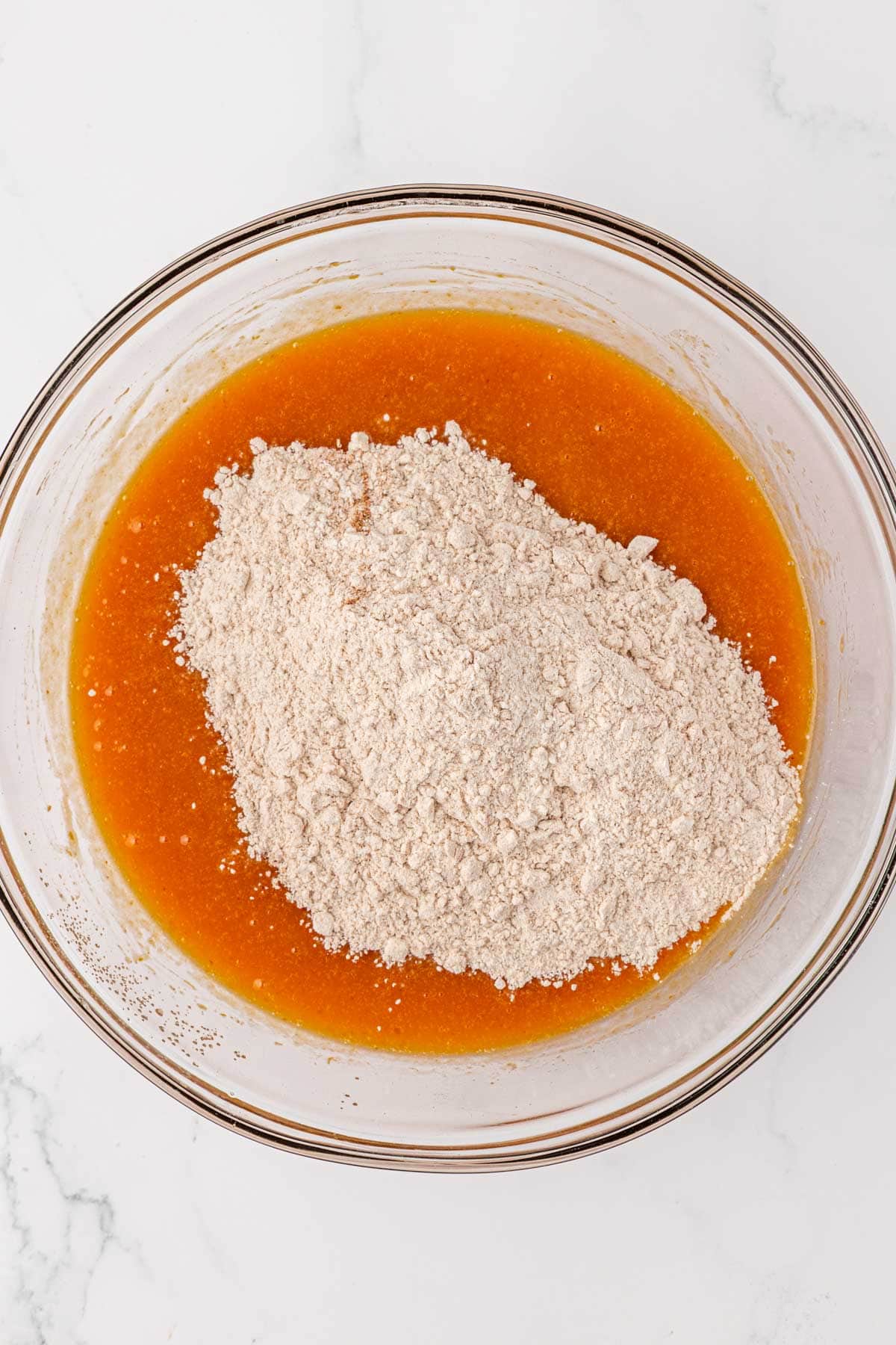 adding the dry ingredients to the wet ingredients