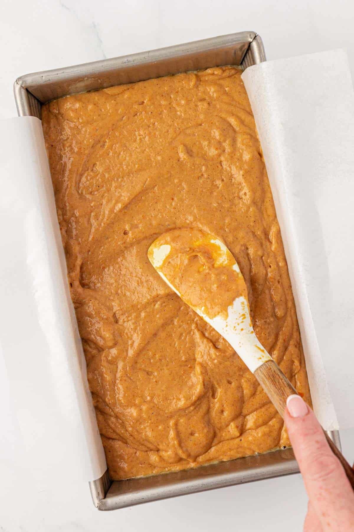 spreading the batter into the loaf pan