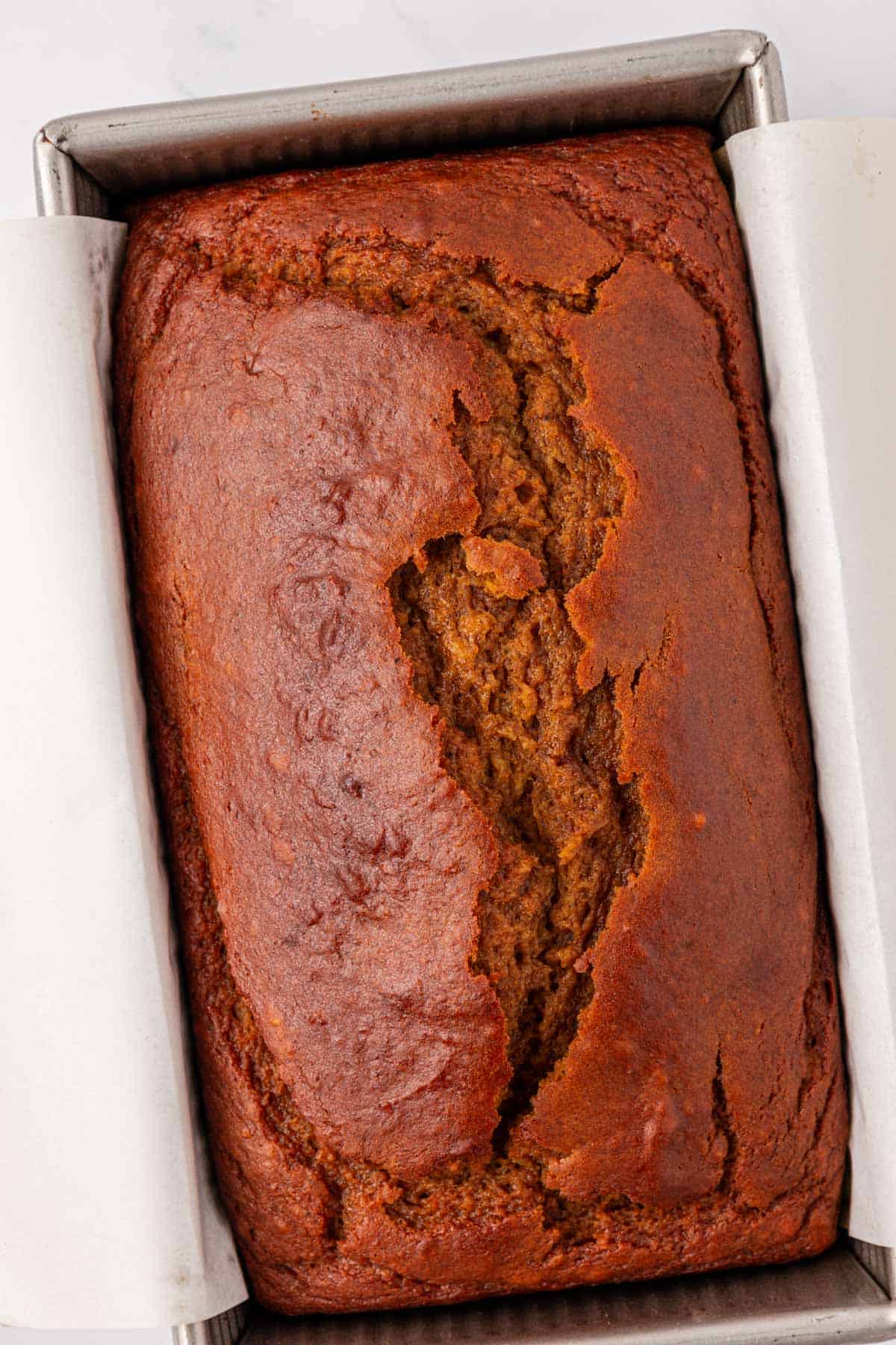 Greek yogurt pumpkin bread loaf in the baking pan