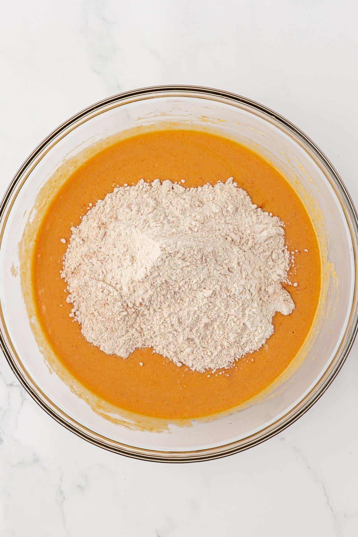 adding the dry ingredients to the wet ingredients