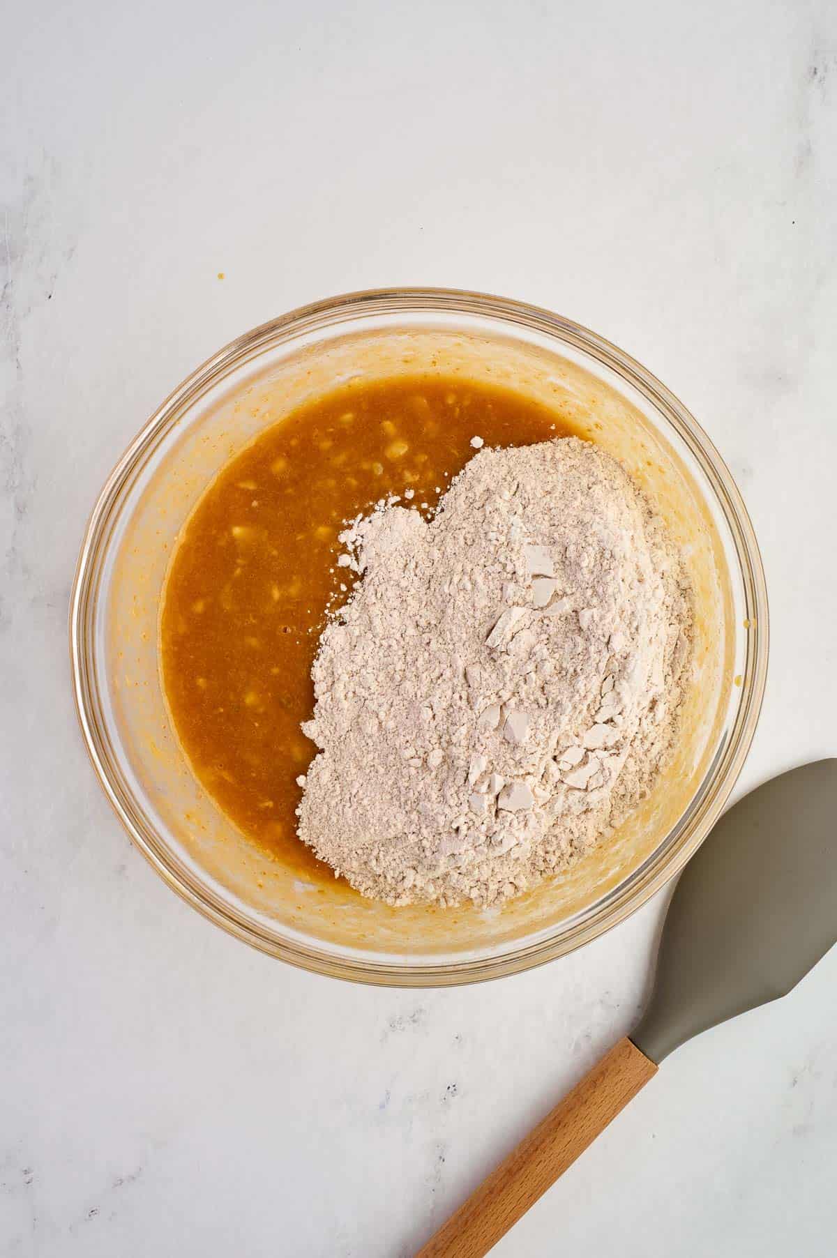 adding the dry ingredients to the wet ingredients