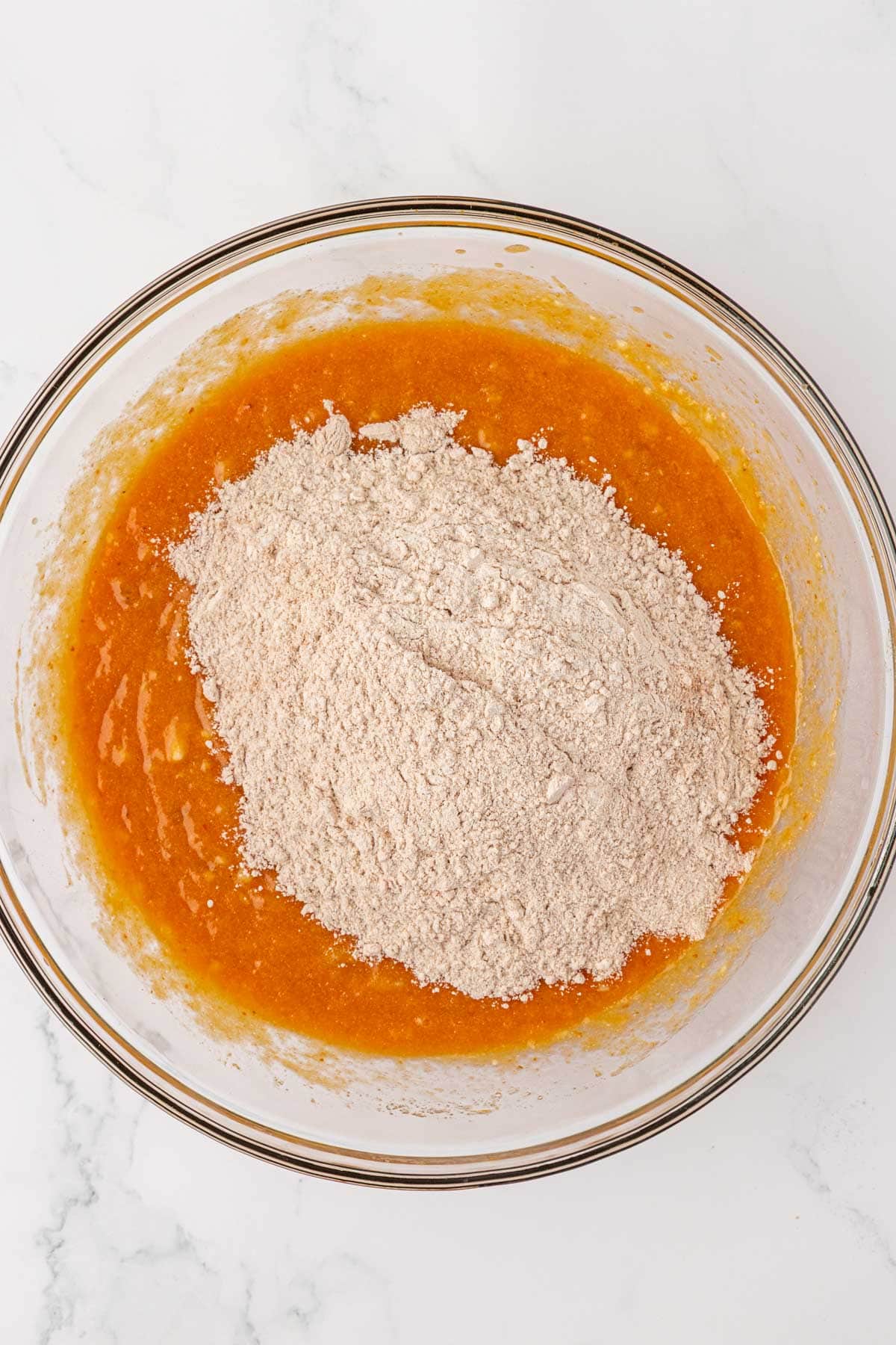 adding the dry ingredients to the wet ingredients