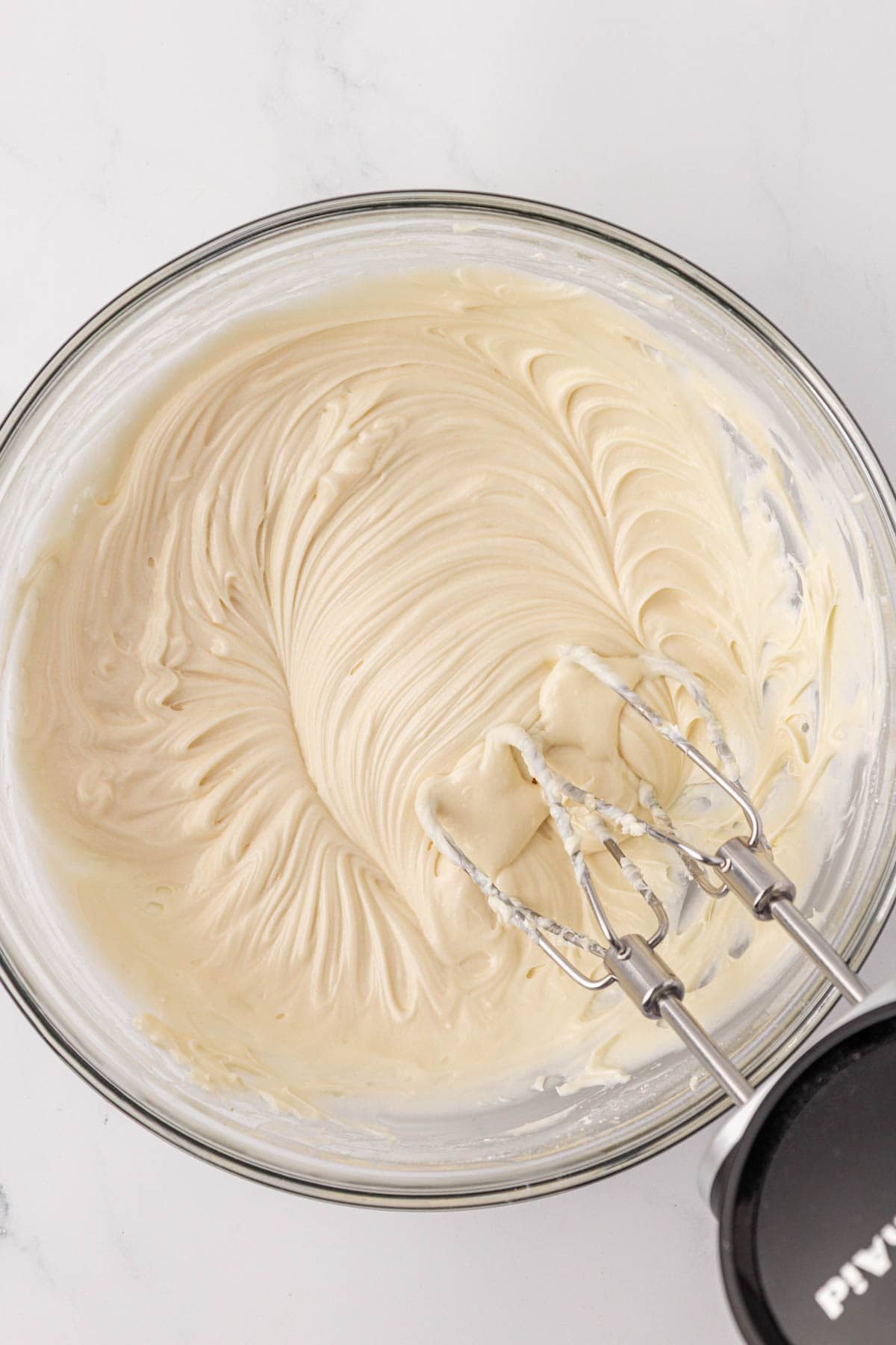 cream cheese frosting in a mixing bowl