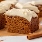 slice of pumpkin snack cake with cream cheese frosting