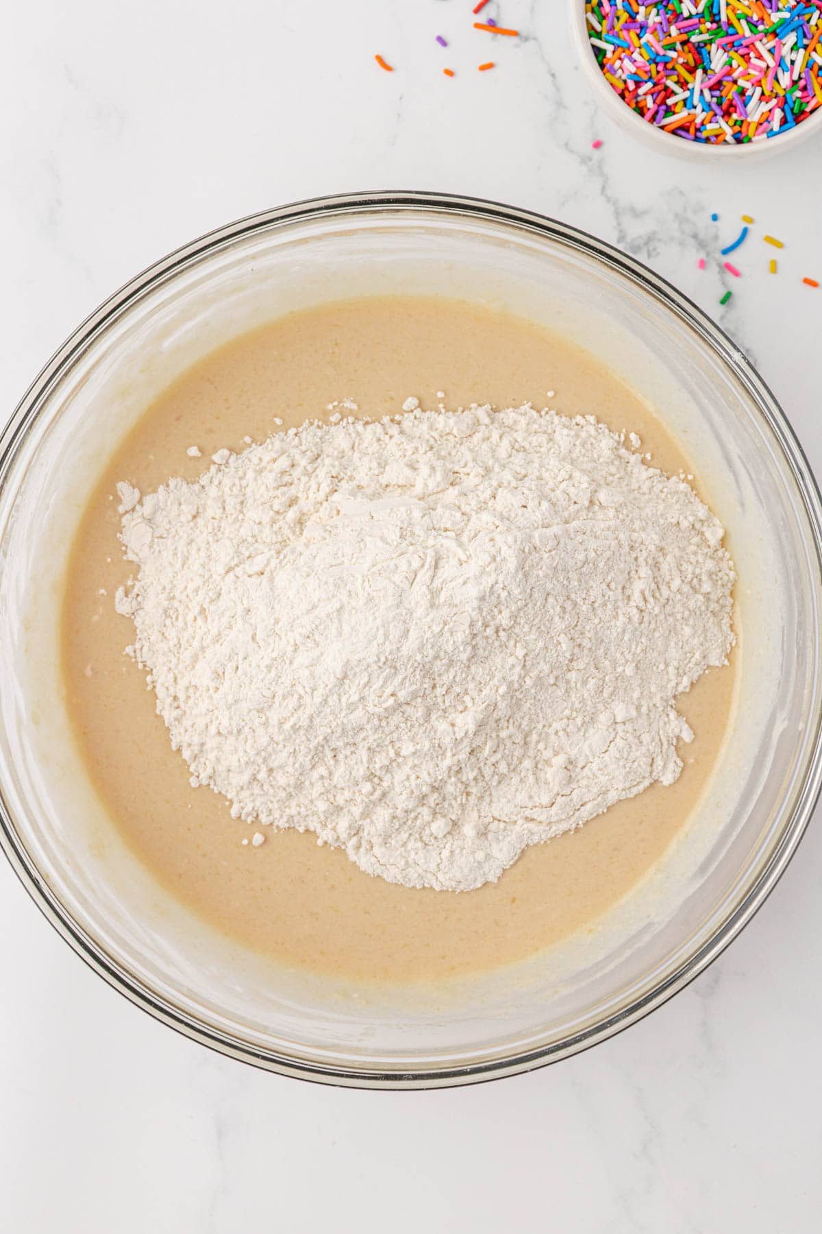 adding the dry ingredients to the wet ingredients